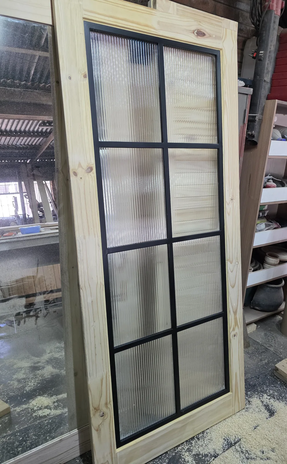 Custom steel-framed door with blackened grid and reeded fluted glass, Crittall-style feature door, South Africa