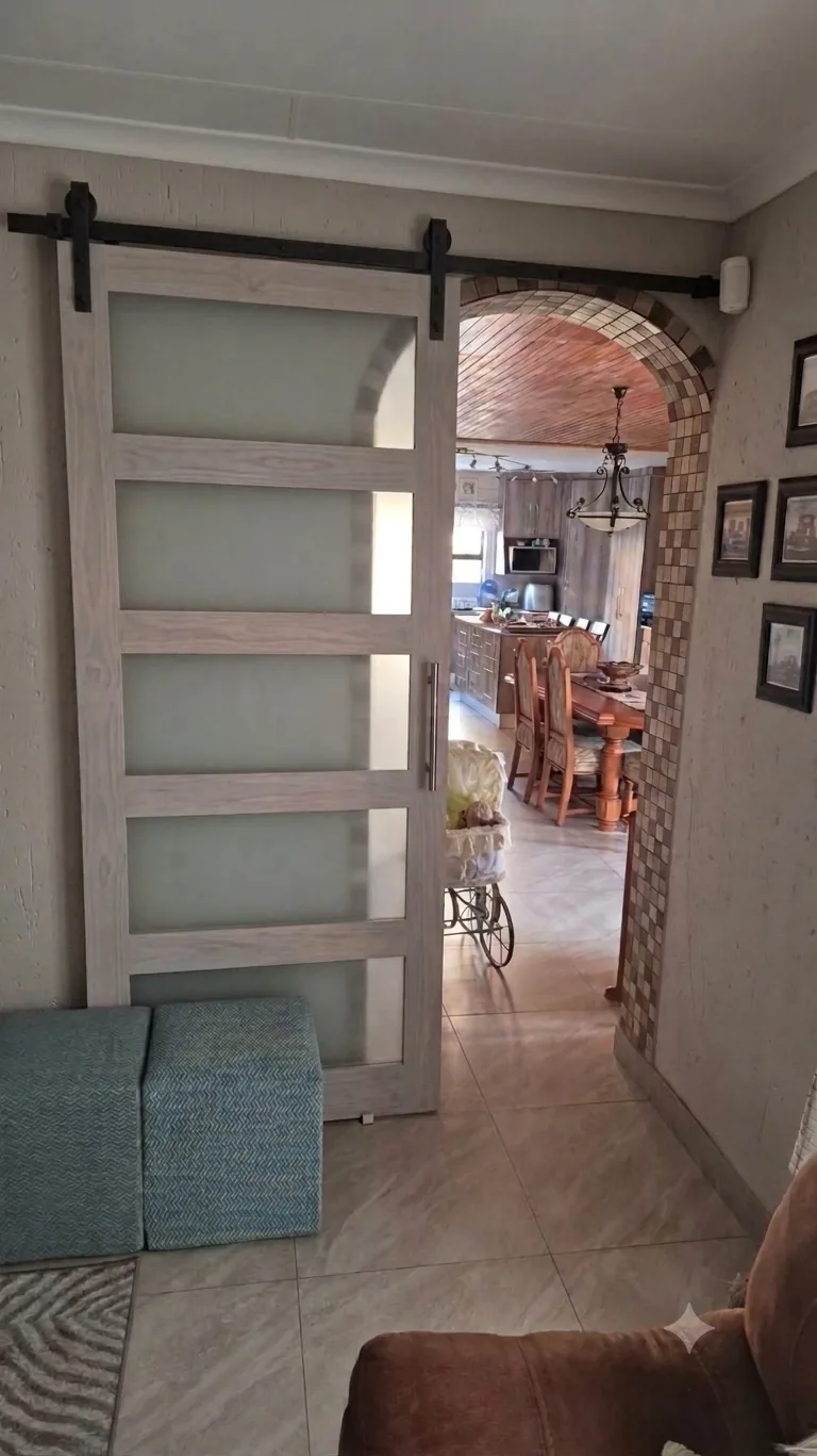 Driftwood-toned frosted glass sliding room divider, bespoke interior commission